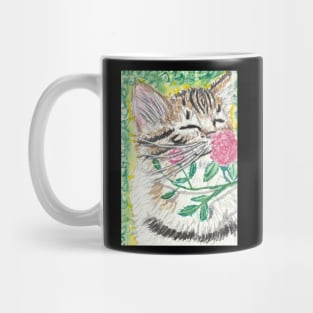 Kitten smelling flower Mug